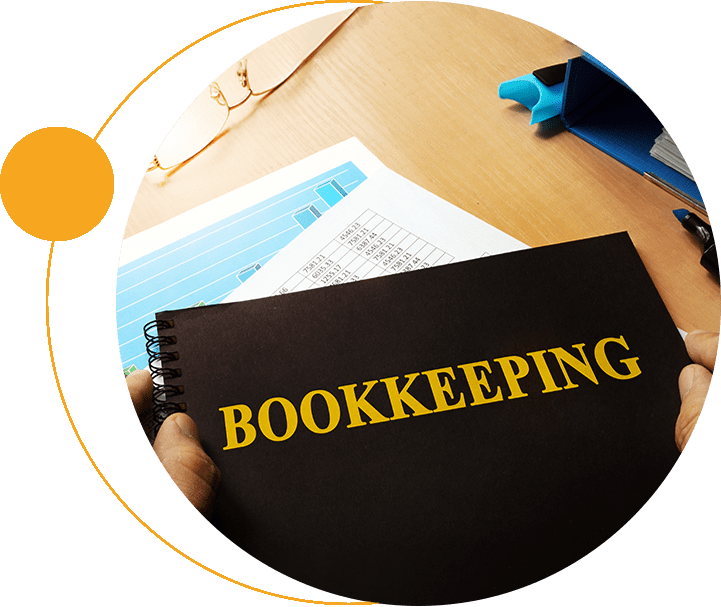 A person holding up a book that says bookkeeping.